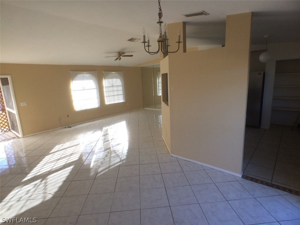18250 Apple Road Fort Myers, FL 33967 - Photo 3 of 19 a view of hallway with window and stairs