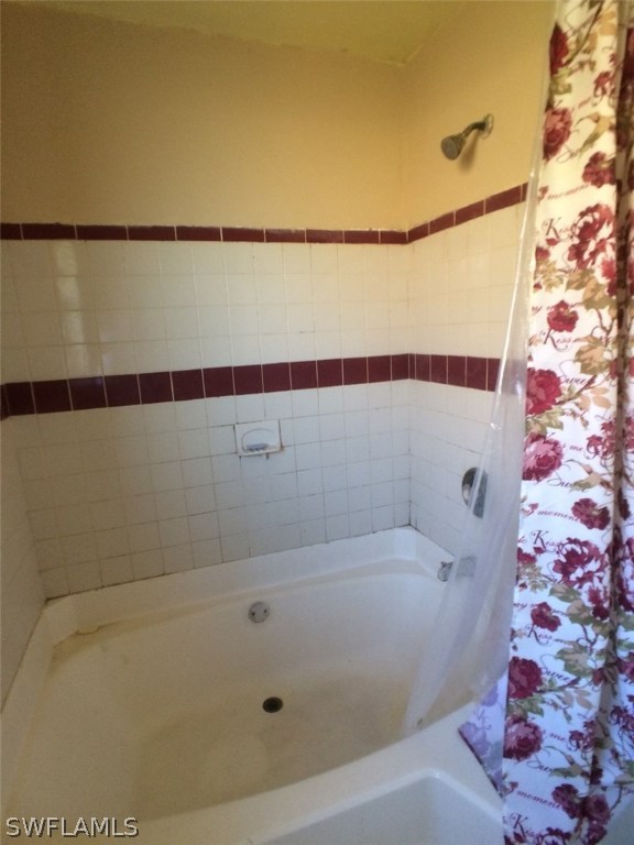 18250 Apple Road Fort Myers, FL 33967 - Photo 10 of 19 a bathroom with a bathtub and shower