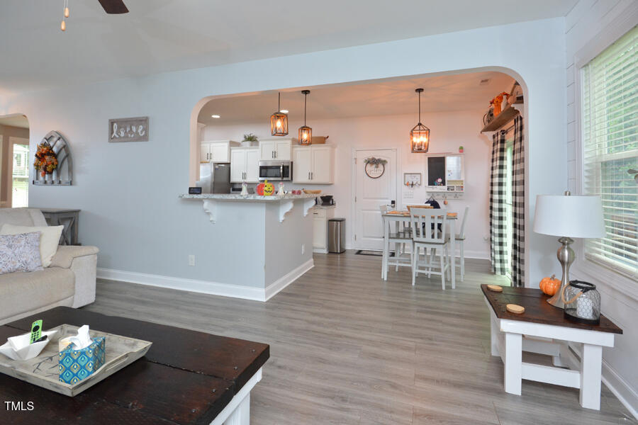 195 Timberwind Road Franklinton, NC 27525 - Photo 9 of 28 a living room with furniture and a table