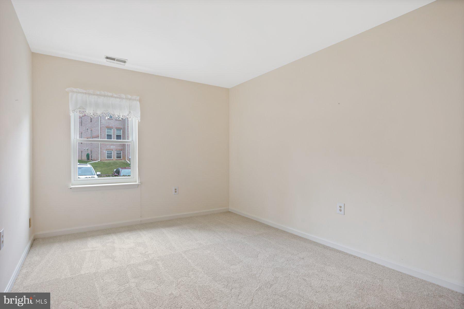 3901 Darleigh Road, Unit 1E Nottingham, MD 21236 - Photo 12 of 27 an empty room with a window