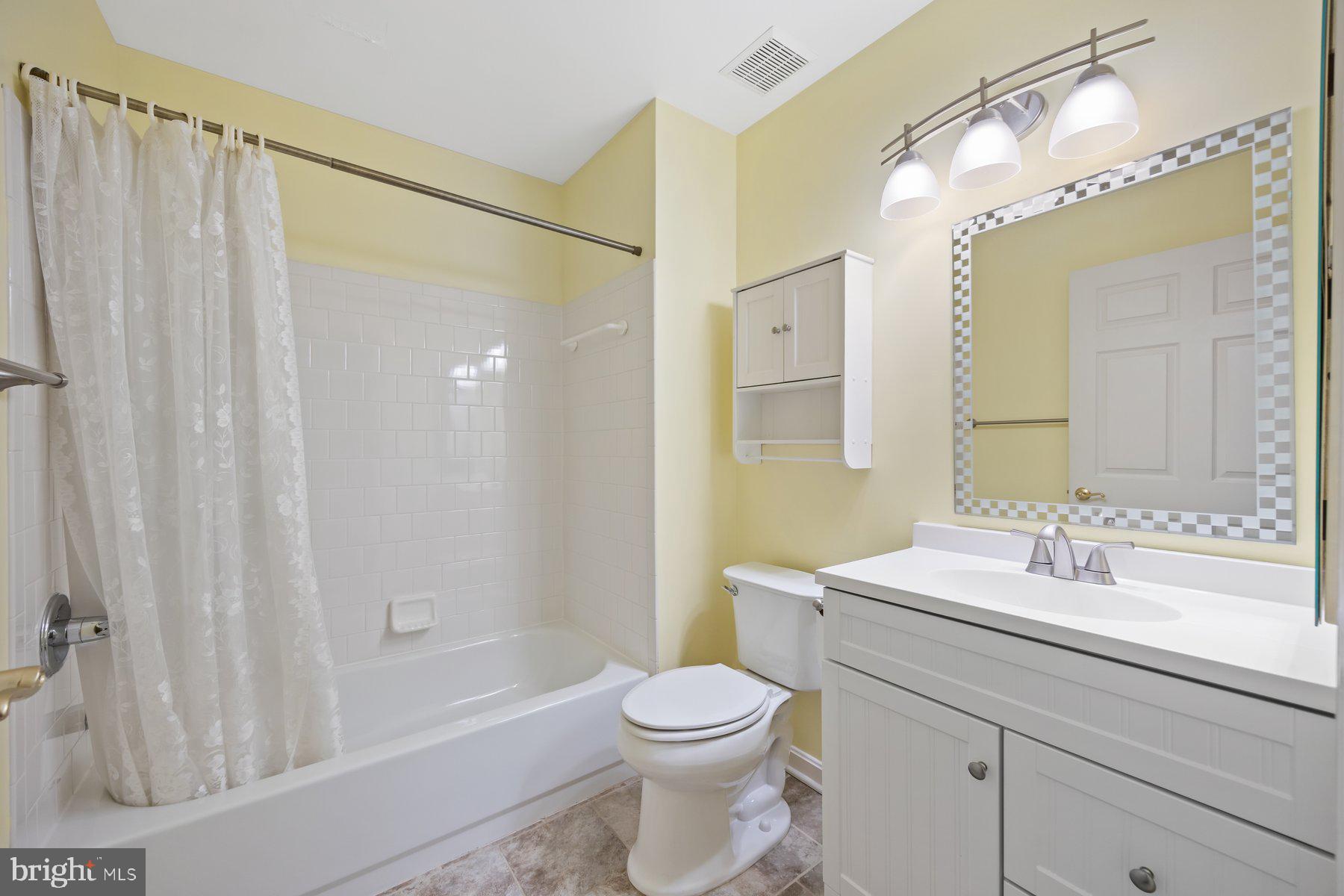 3901 Darleigh Road, Unit 1E Nottingham, MD 21236 - Photo 18 of 27 a bathroom with a sink a toilet and shower