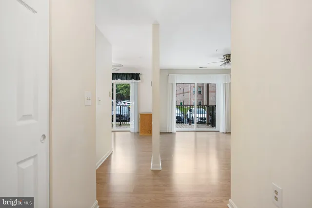 a view of an entryway with wooden floor