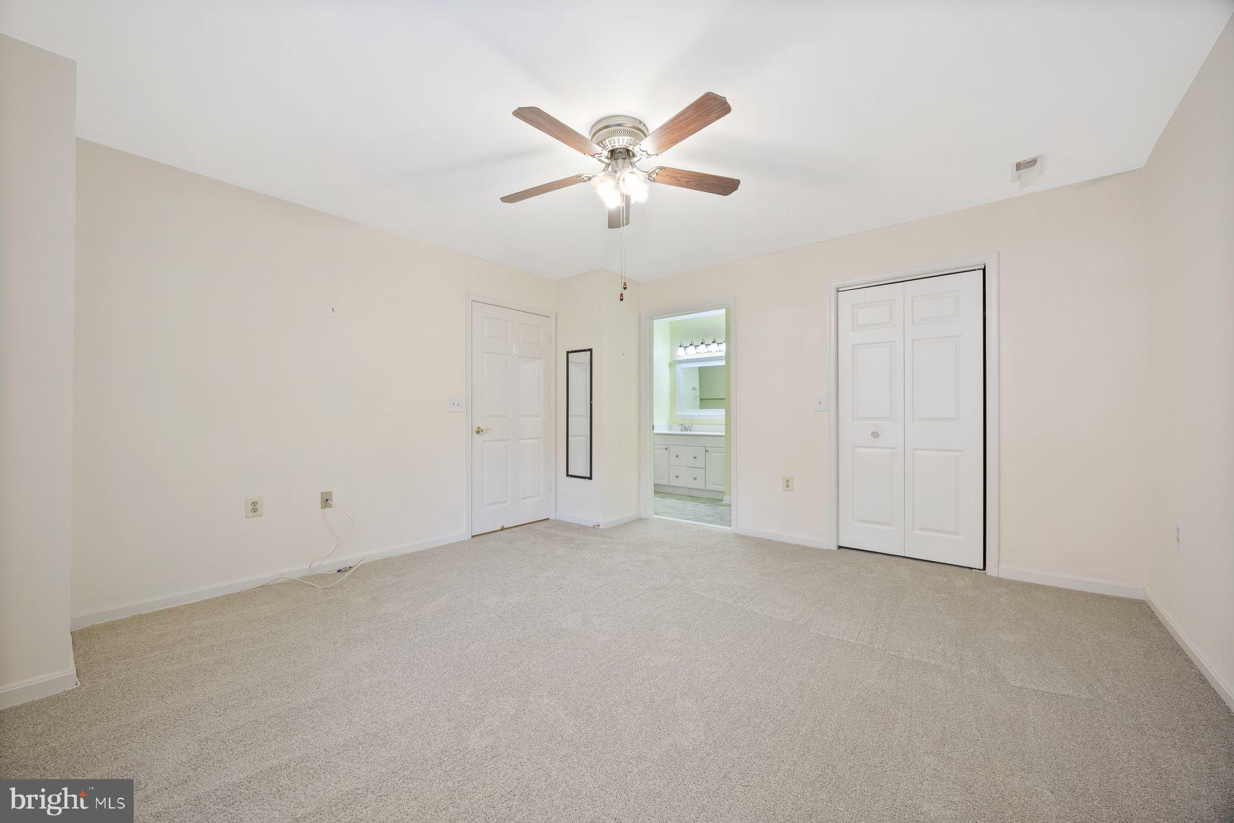 3901 Darleigh Road, Unit 1E Nottingham, MD 21236 - Photo 21 of 27 an empty room with closet and windows