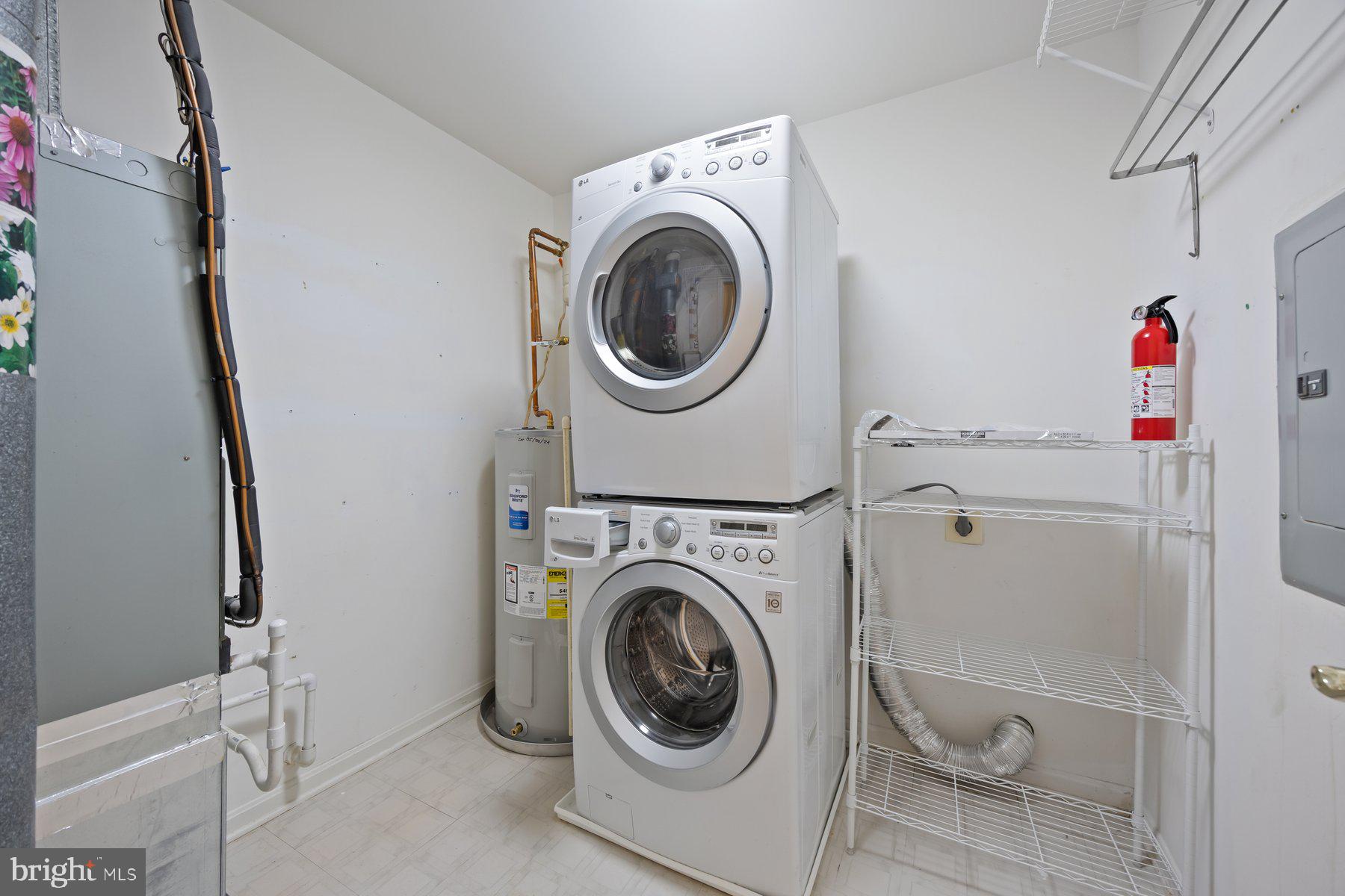 3901 Darleigh Road, Unit 1E Nottingham, MD 21236 - Photo 25 of 27 a utility room with dryer and washer