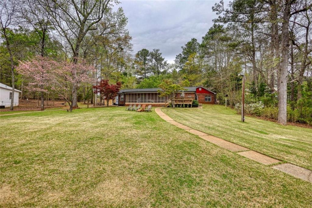 1665 County Line Road Mansfield, GA 30055 - Photo 2 of 74 a view of a playground with basketball court