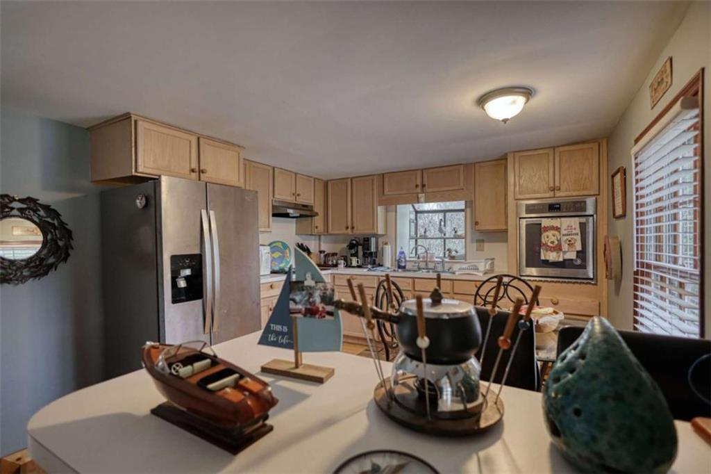 1665 County Line Road Mansfield, GA 30055 - Photo 21 of 74 a room with furniture a flat screen tv and a large window