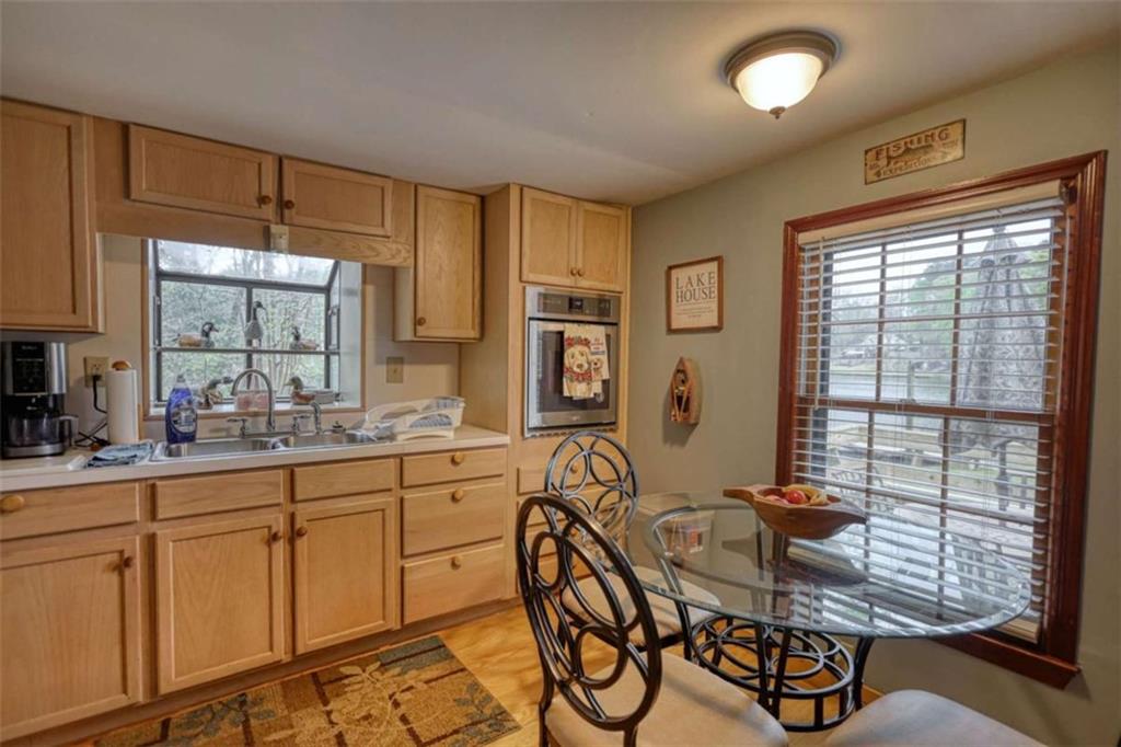 1665 County Line Road Mansfield, GA 30055 - Photo 22 of 74 a kitchen with sink table and chairs