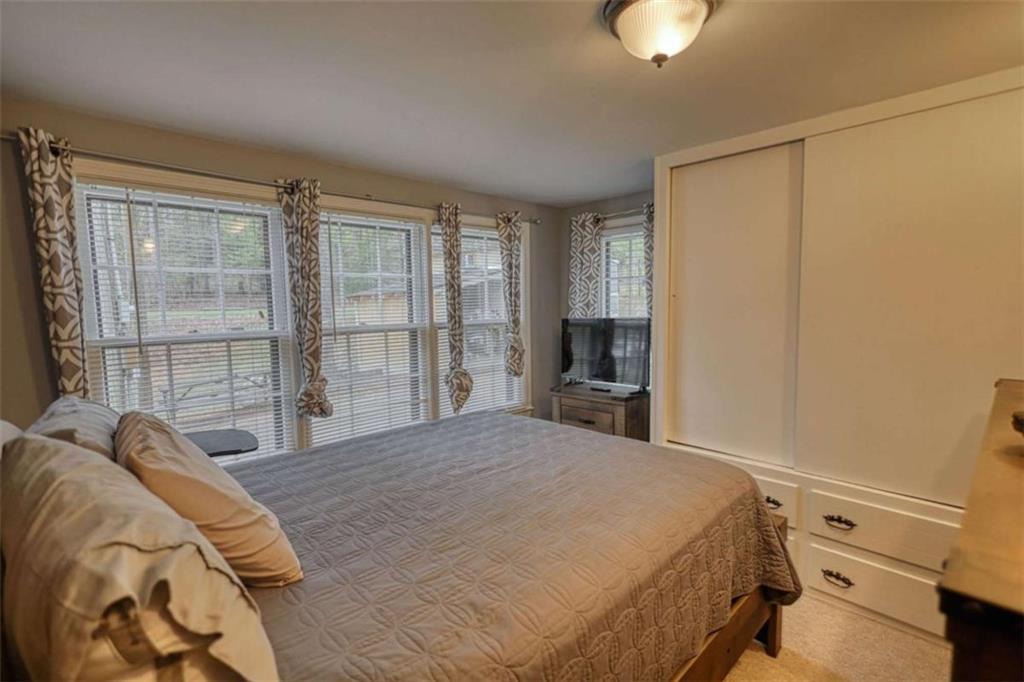 1665 County Line Road Mansfield, GA 30055 - Photo 28 of 74 a bedroom with a bed and a large window