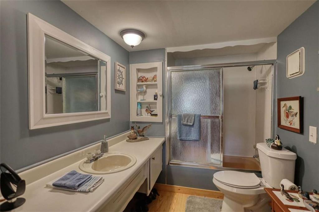 1665 County Line Road Mansfield, GA 30055 - Photo 29 of 74 a bathroom with a granite countertop sink toilet and shower