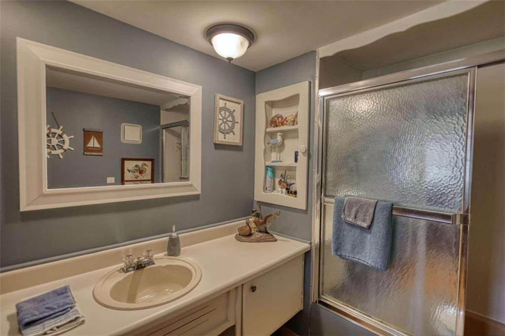 1665 County Line Road Mansfield, GA 30055 - Photo 30 of 74 a bathroom with a sink and mirror