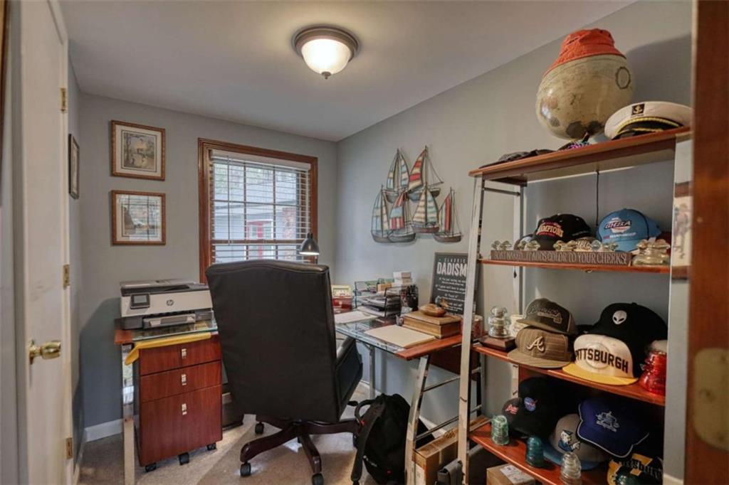 1665 County Line Road Mansfield, GA 30055 - Photo 31 of 74 a view of a workspace with furniture and lamp