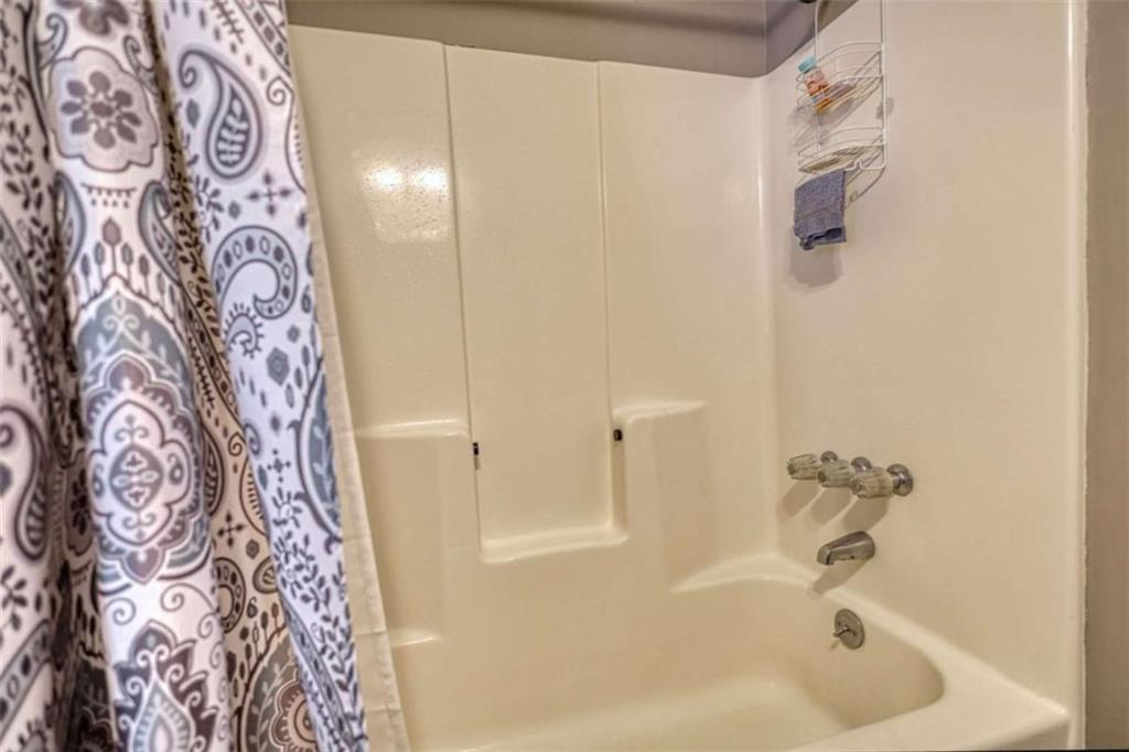 1665 County Line Road Mansfield, GA 30055 - Photo 33 of 74 a bathroom with a bathtub and shower