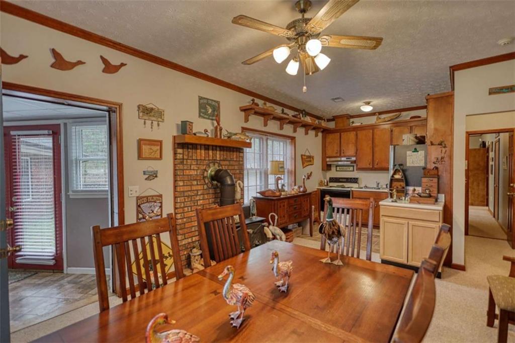 1665 County Line Road Mansfield, GA 30055 - Photo 42 of 74 a view of a dining room with furniture window and wooden floor