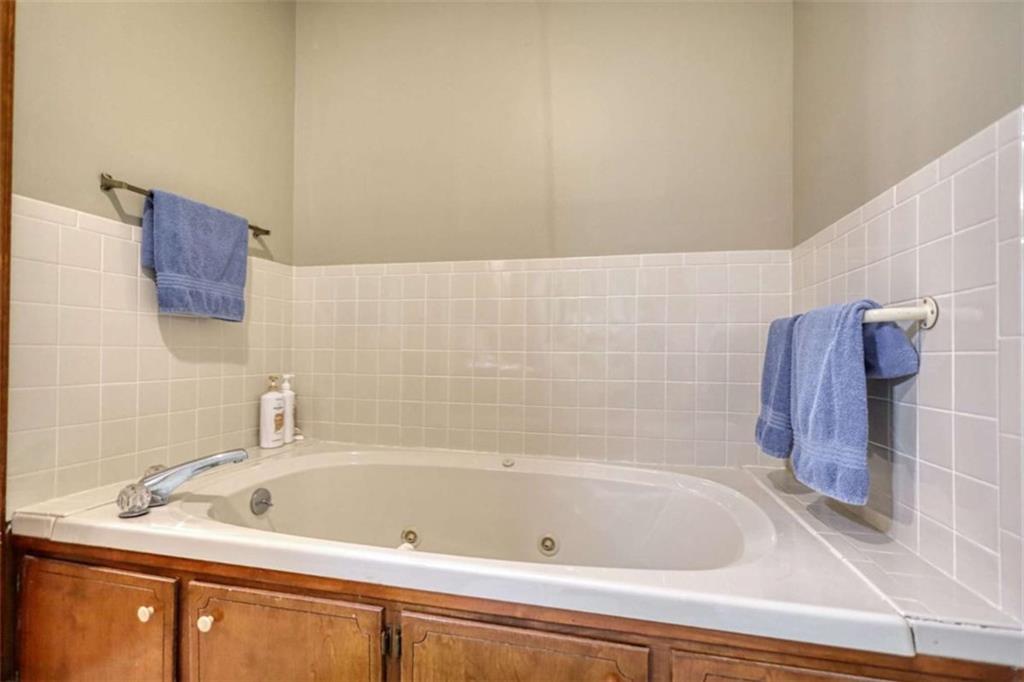 1665 County Line Road Mansfield, GA 30055 - Photo 51 of 74 a bathroom with a bath tub and a sink