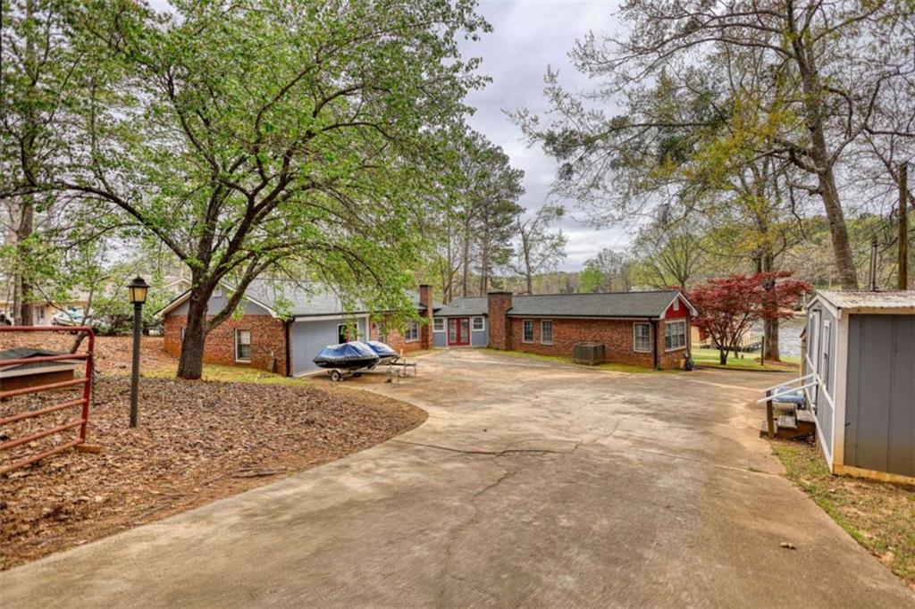 1665 County Line Road Mansfield, GA 30055 - Photo 55 of 74 a house with trees in front of it