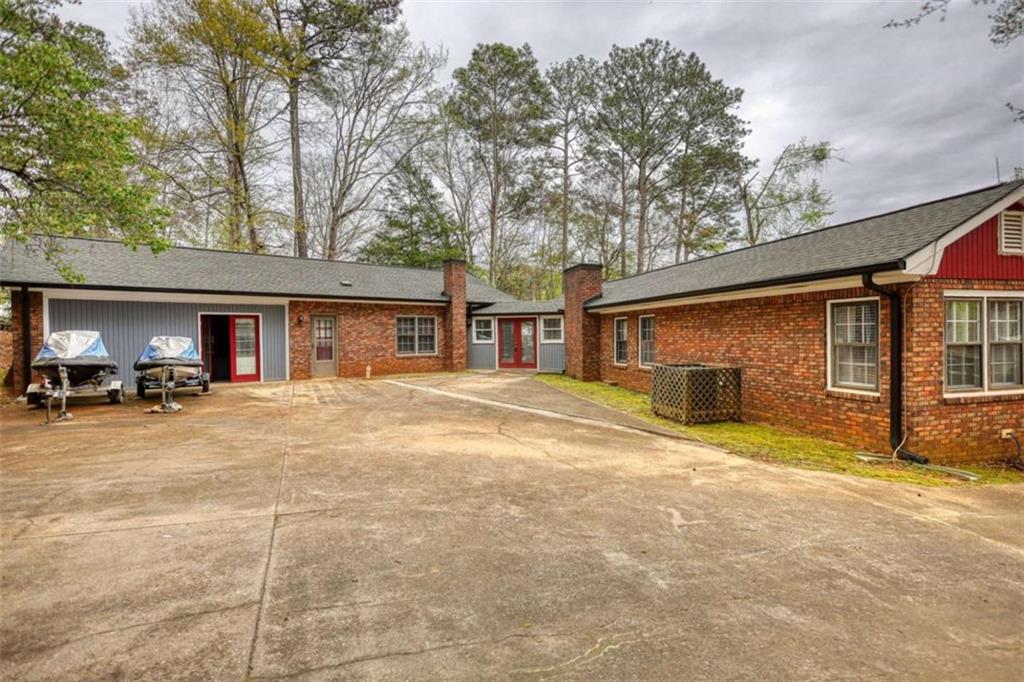 1665 County Line Road Mansfield, GA 30055 - Photo 57 of 74 a view of a house with backyard and chairs
