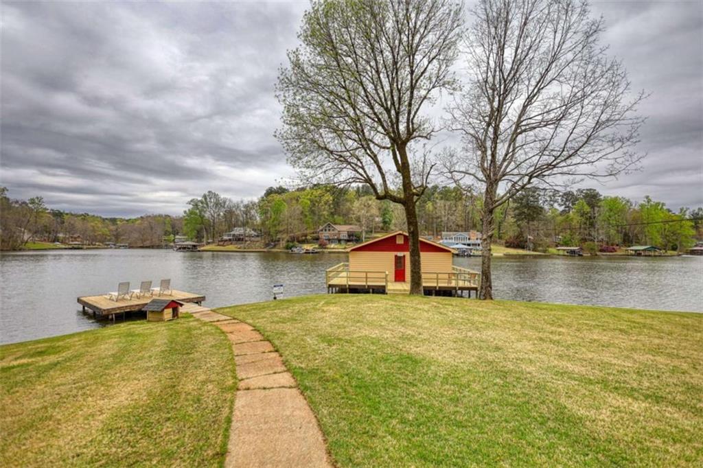 1665 County Line Road Mansfield, GA 30055 - Photo 60 of 74 a view of a lake with house next to a yard