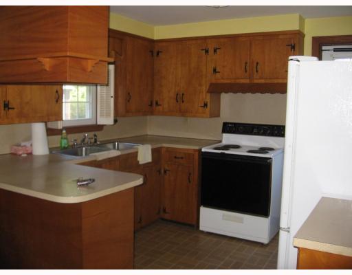 51 Greylock Road Bristol, RI 02809 - Photo 2 of 9 Kitchen. The kitchen features solid wood cabinets and new appliances.