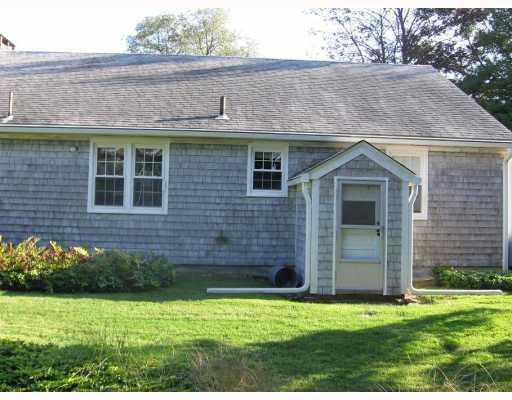 51 Greylock Road Bristol, RI 02809 - Photo 6 of 9 Exterior Back. A nice double lot with a pretty stone wall and flowering trees.