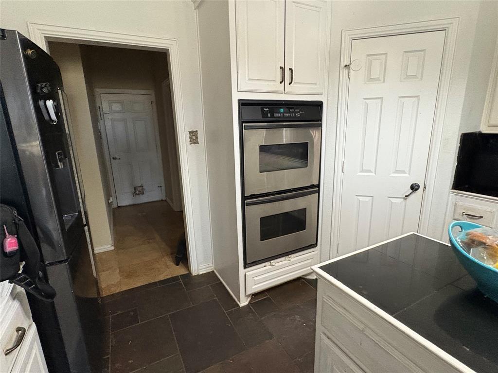 709 Timberview Court North Fort Worth, TX 76112 - Photo 7 of 14 a view of a kitchen from the hallway