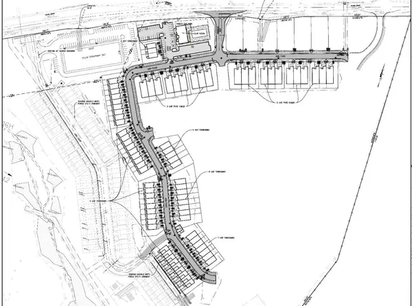 a picture of a bathroom with a white wall