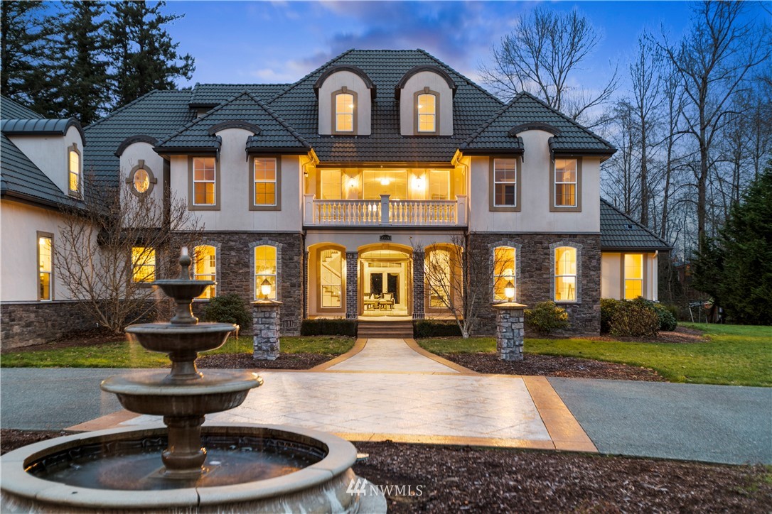 20630 Southeast 216th Street Maple Valley, WA 98038 - Photo 2 of 40 a front view of a house with a garden