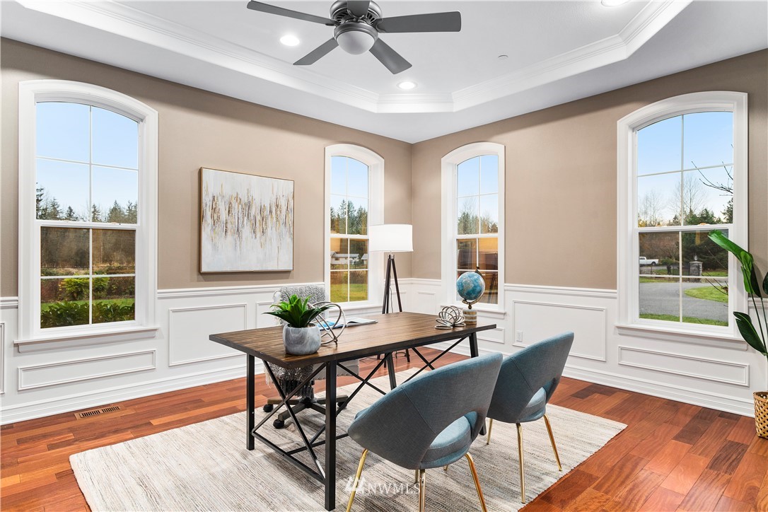 20630 Southeast 216th Street Maple Valley, WA 98038 - Photo 11 of 40 a view of a dining room with furniture window and wooden floor