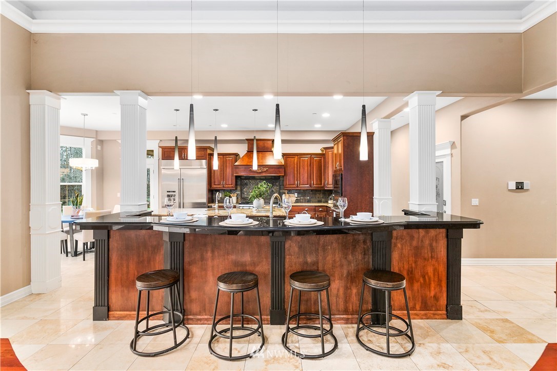 20630 Southeast 216th Street Maple Valley, WA 98038 - Photo 16 of 40 a kitchen with a table and chairs