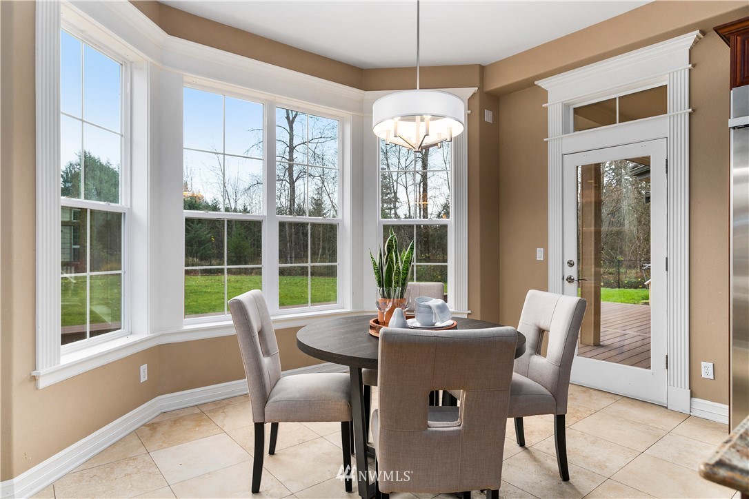 20630 Southeast 216th Street Maple Valley, WA 98038 - Photo 17 of 40 a view of a dining room with furniture window and outside view