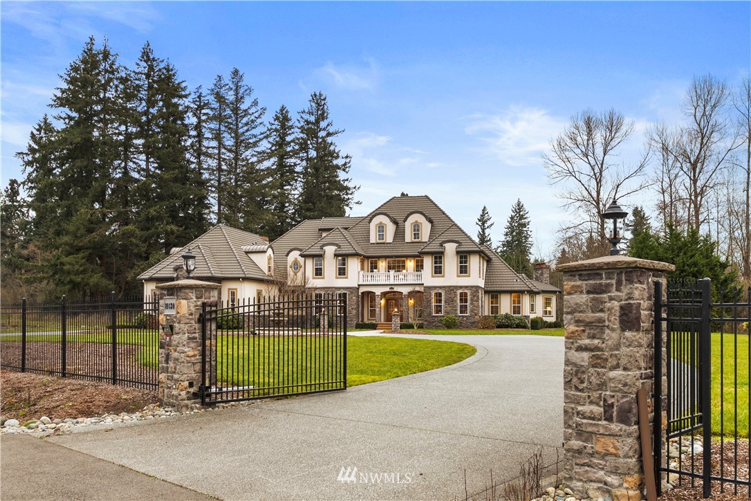 20630 Southeast 216th Street Maple Valley, WA 98038 - Photo 33 of 40 a view of a wooden house with a big yard and large trees