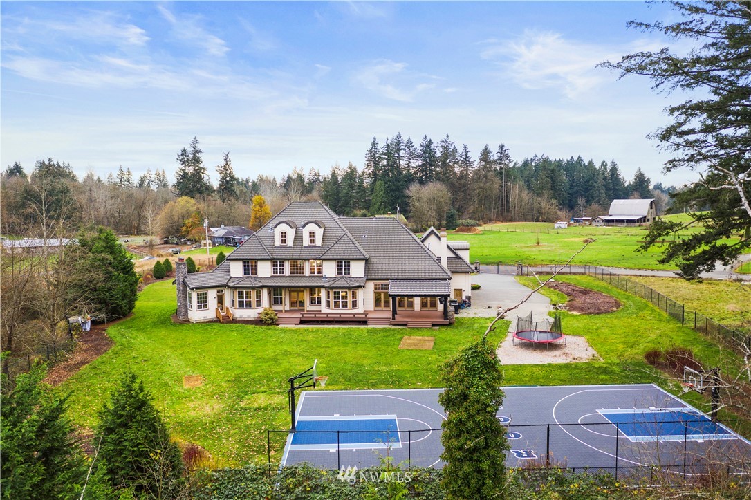 20630 Southeast 216th Street Maple Valley, WA 98038 - Photo 35 of 40 an aerial view of a house with garden space lake view and mountain view in back