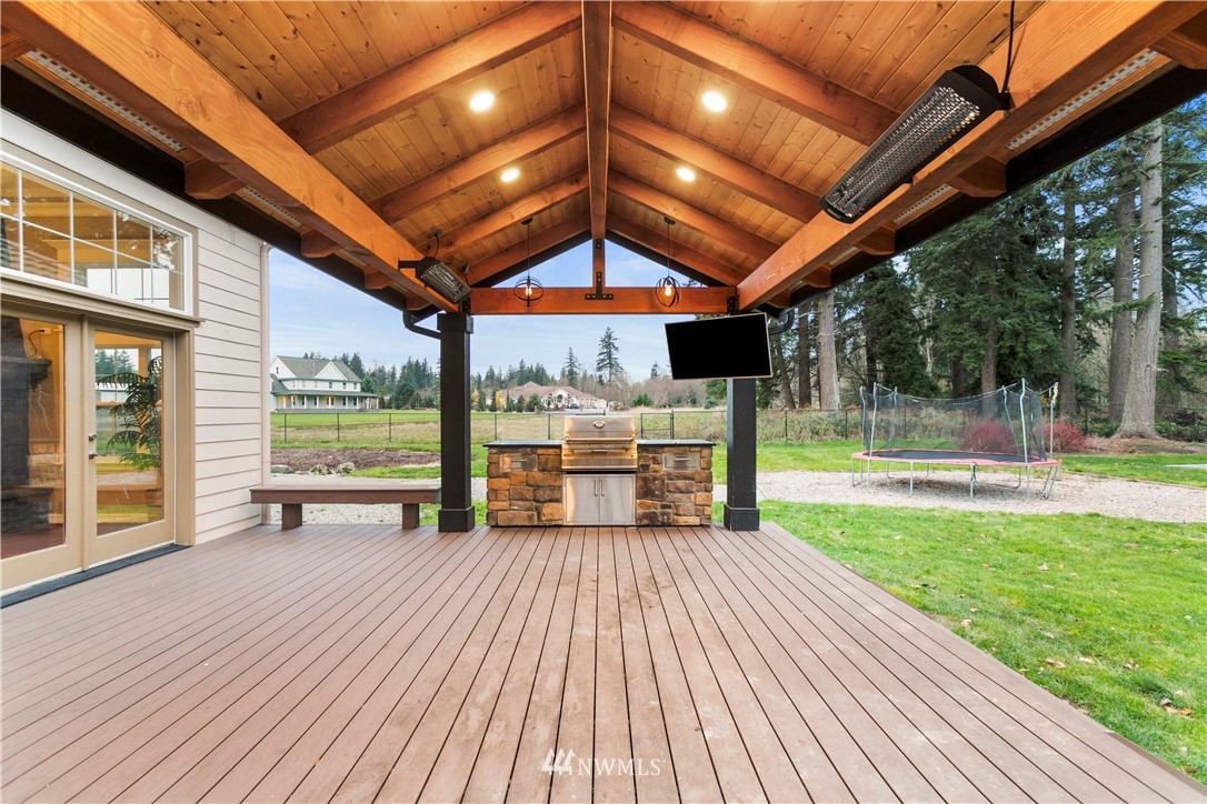 20630 Southeast 216th Street Maple Valley, WA 98038 - Photo 37 of 40 a view of a patio with wooden floor and outer view