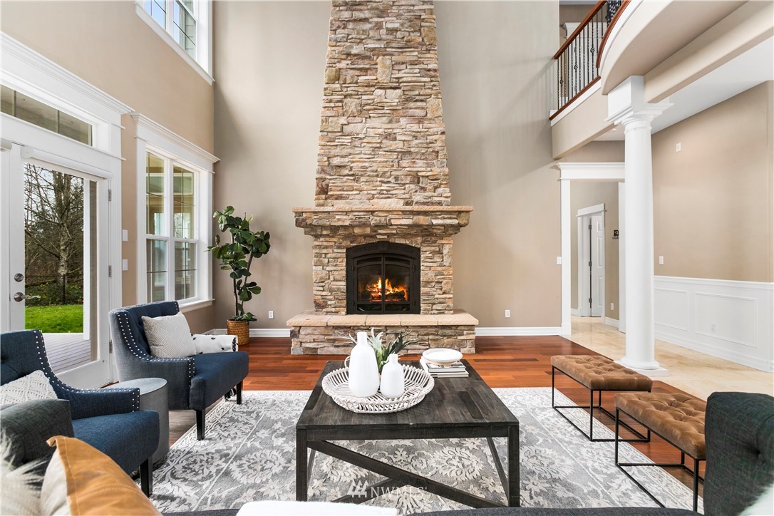 20630 Southeast 216th Street Maple Valley, WA 98038 - Photo 6 of 40 a living room with furniture fireplace and a large window
