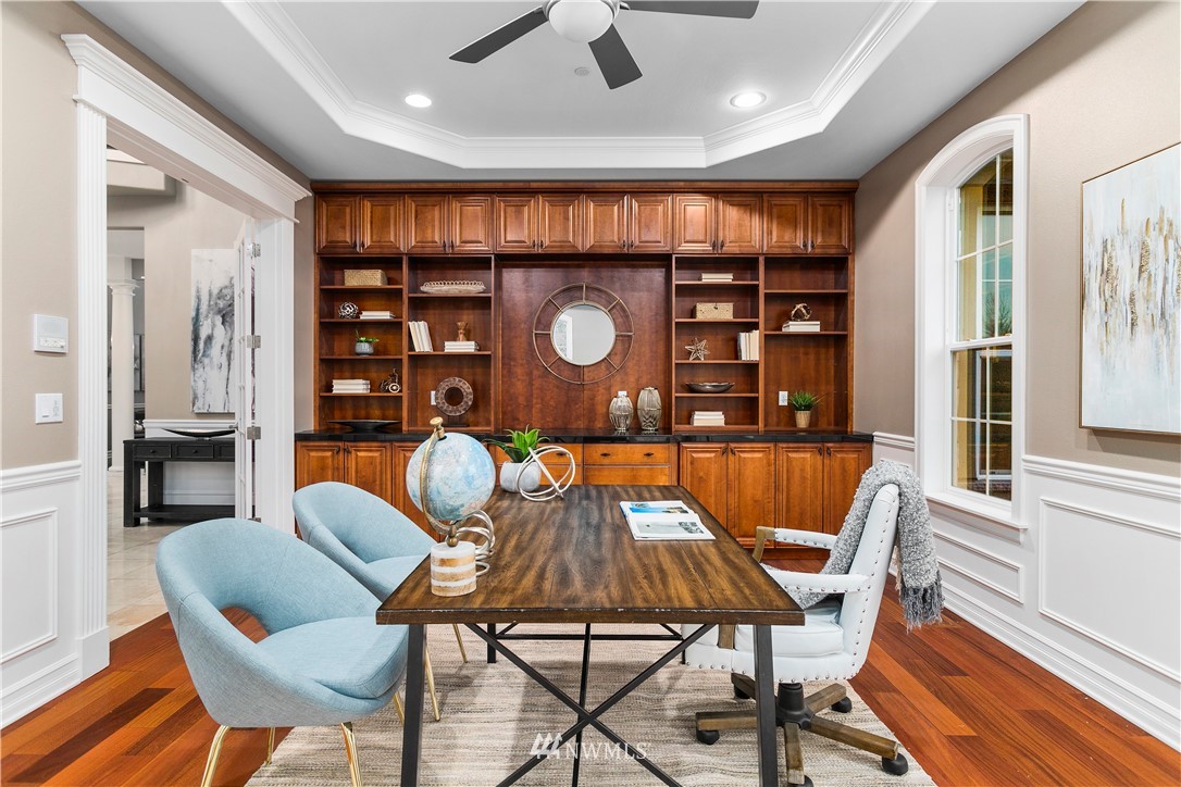 20630 Southeast 216th Street Maple Valley, WA 98038 - Photo 10 of 40 a dining room with furniture and wooden floor