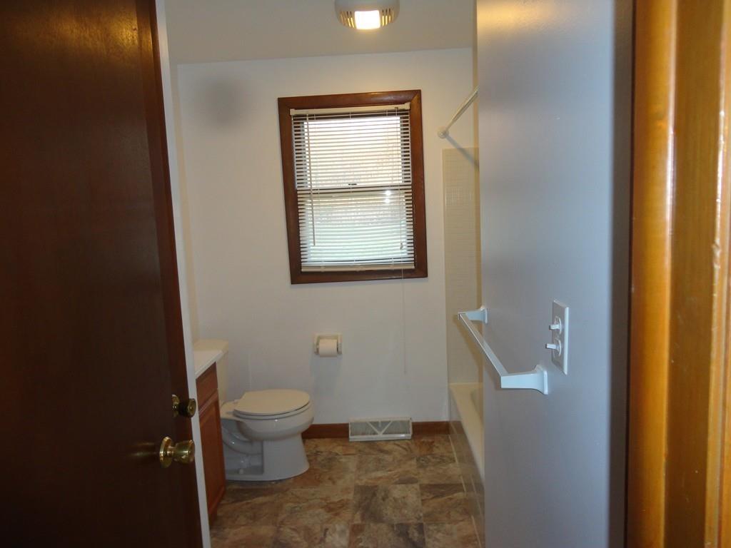 103 Garnet Street Springfield, MA 01129 - Photo 10 of 16 a bathroom with a toilet sink and a mirror