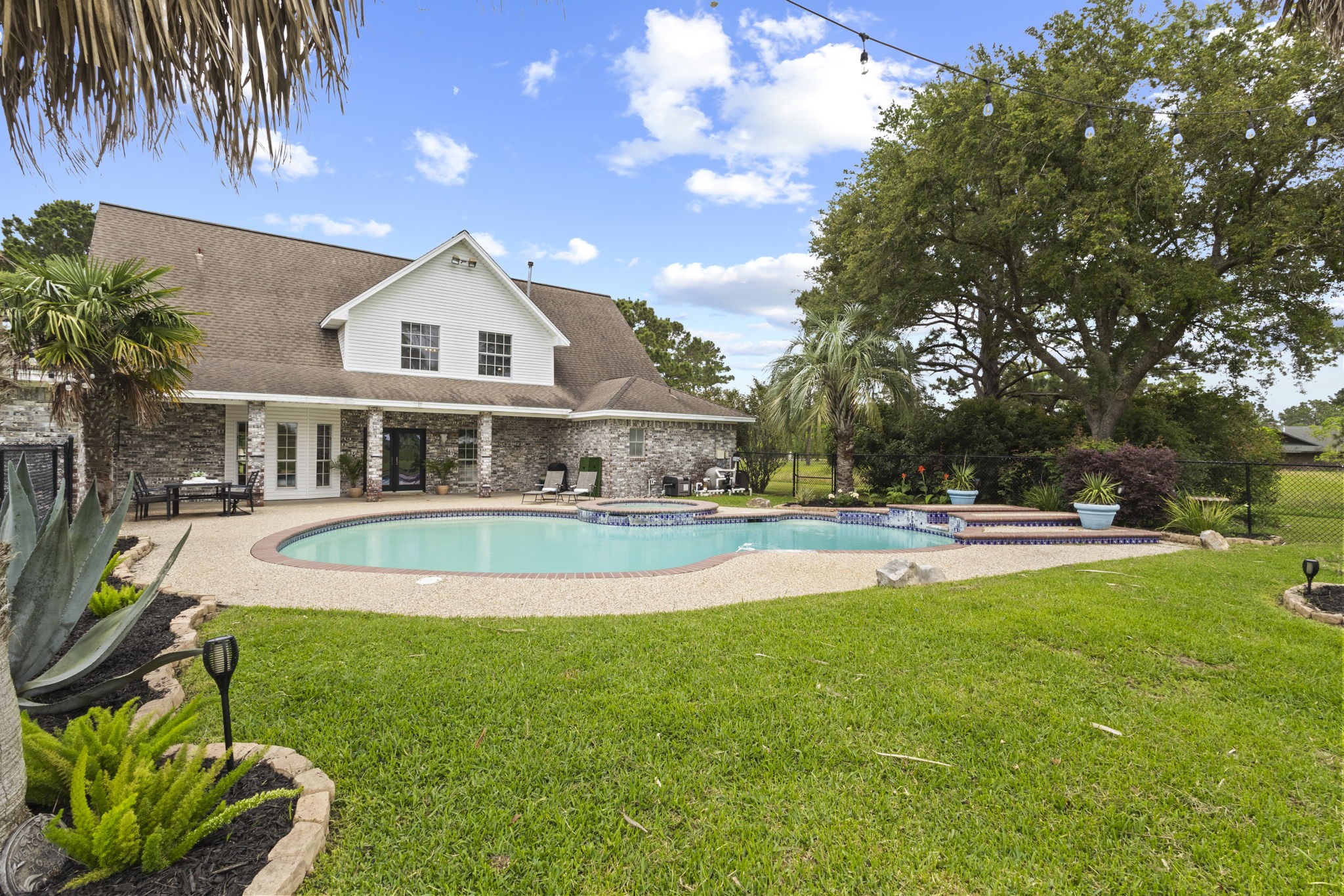 16421 Westbury Road Beaumont, TX 77713 - Photo 2 of 29 a view of a house with swimming pool and a yard