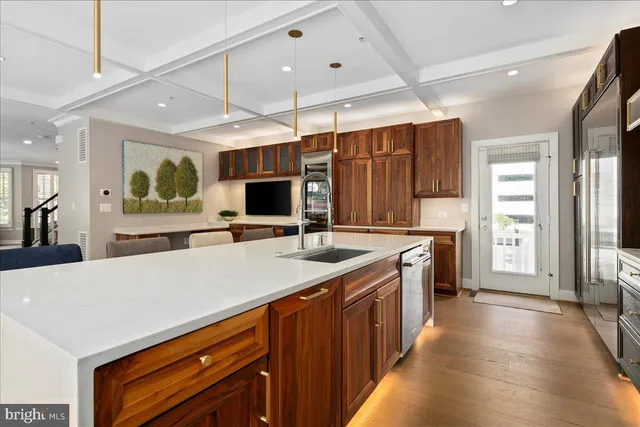 a kitchen with a sink stove and refrigerator