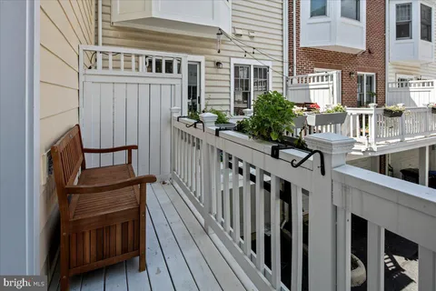 a view of a house with wooden deck