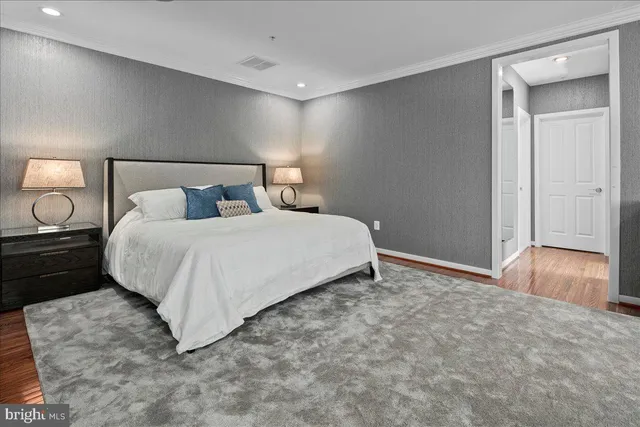 a bedroom with a bed and a lamp