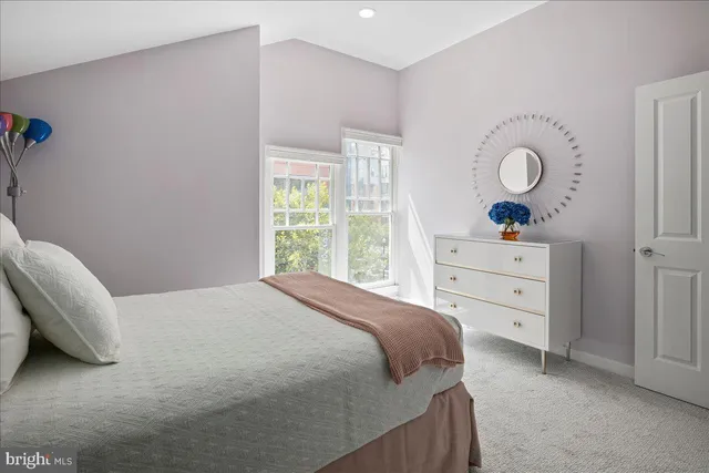 a bedroom with a bed and a closet