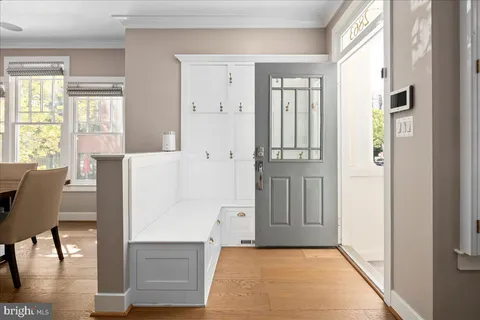 a view of kitchen with furniture and wooden floor