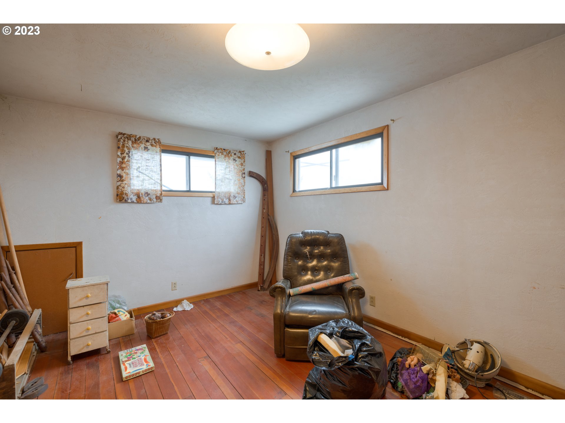 7120 Perrydale Road Amity, OR 97101 - Photo 13 of 16 a room with gym equipment on wooden floor