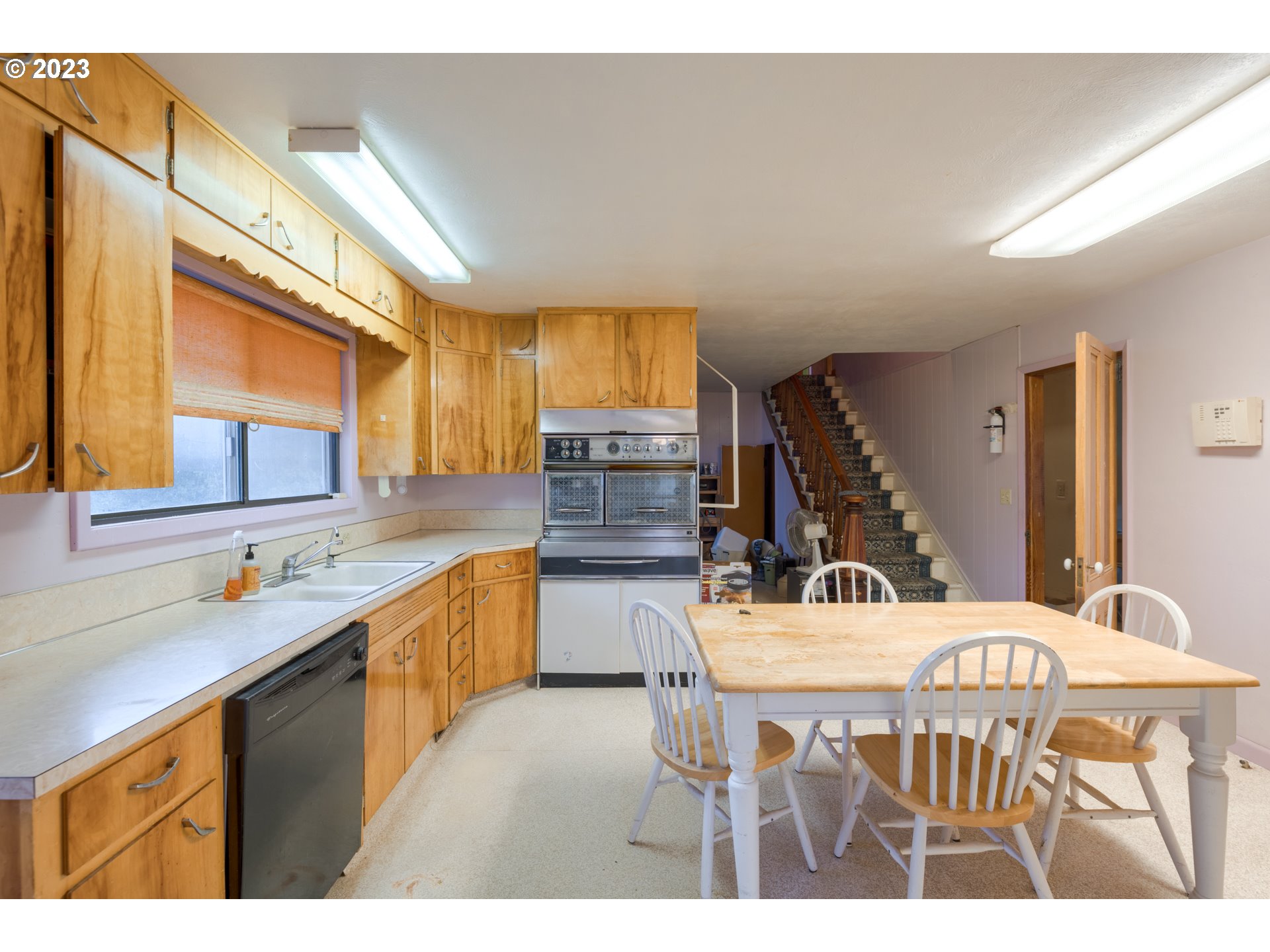 7120 Perrydale Road Amity, OR 97101 - Photo 8 of 16 a kitchen with a table chairs stove and cabinets