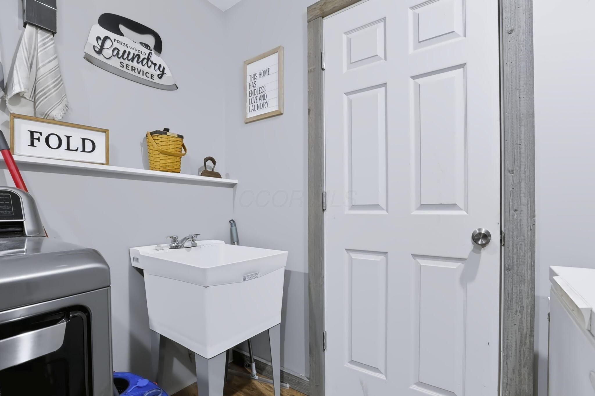 2403 Hickman Road Northeast Newark, OH 43055 - Photo 25 of 62 First Floor Laundry Room