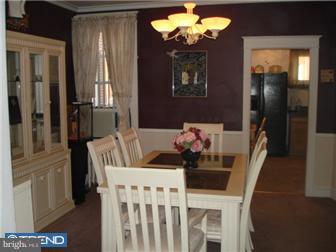 240 Wembly Road Upper Darby, PA 19082 - Photo 4 of 12 a view of a dining room with furniture and chandelier