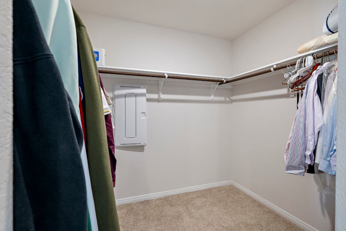 19601 Abigail Fillmore Road Manor, TX 78653 - Photo 11 of 17 a view of walk in closet with clothes and shoes
