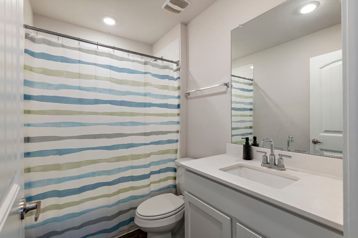 19601 Abigail Fillmore Road Manor, TX 78653 - Photo 13 of 17 a bathroom with a sink toilet and shower
