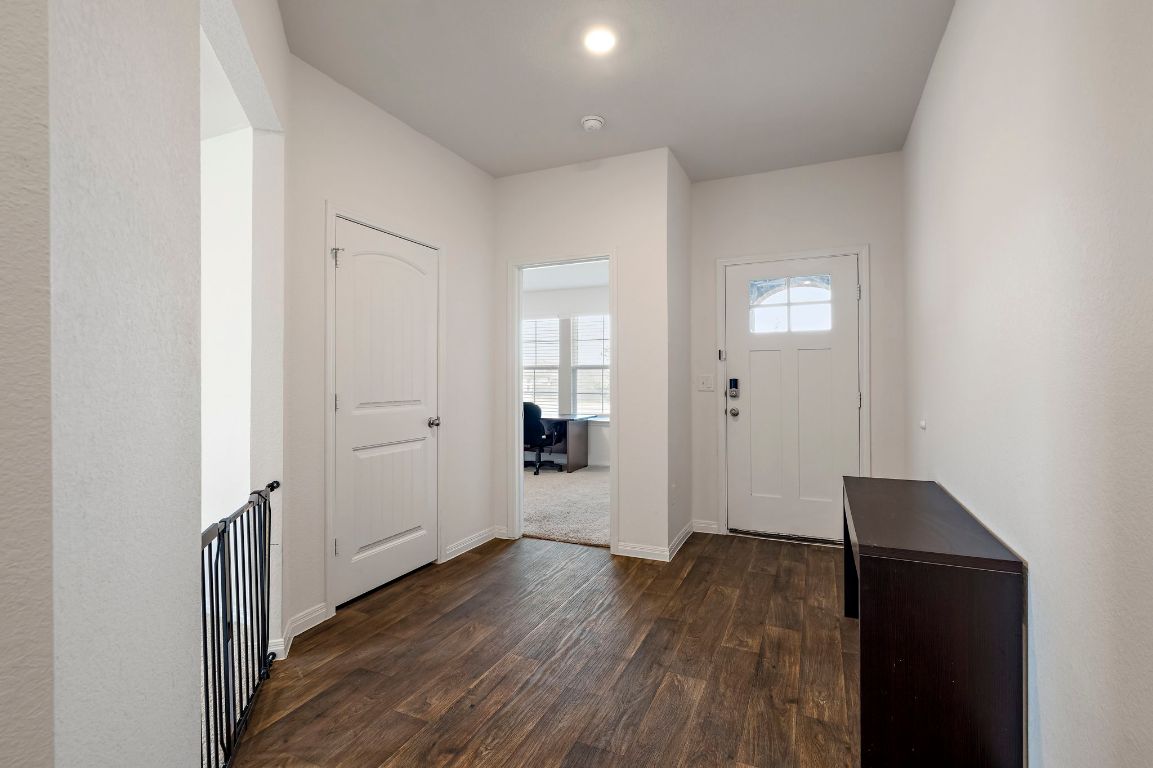 19601 Abigail Fillmore Road Manor, TX 78653 - Photo 14 of 17 an empty room with wooden floor & windows