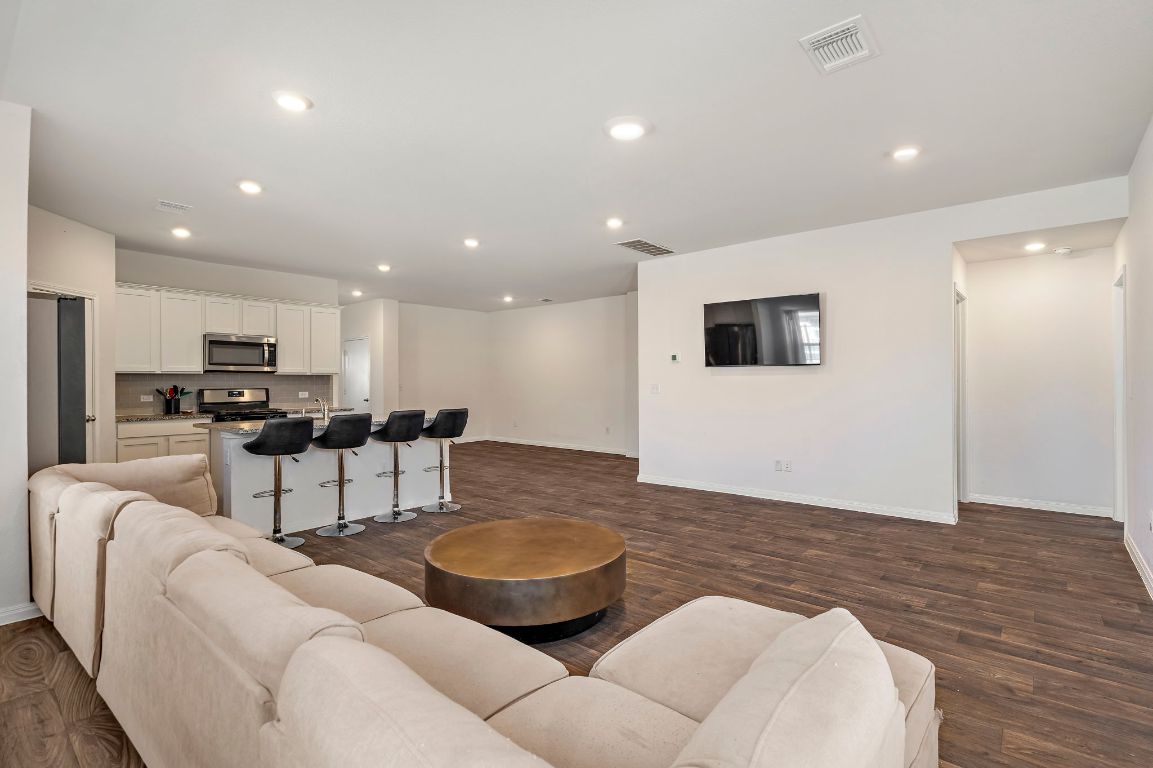 19601 Abigail Fillmore Road Manor, TX 78653 - Photo 4 of 17 a living room with furniture and view of kitchen