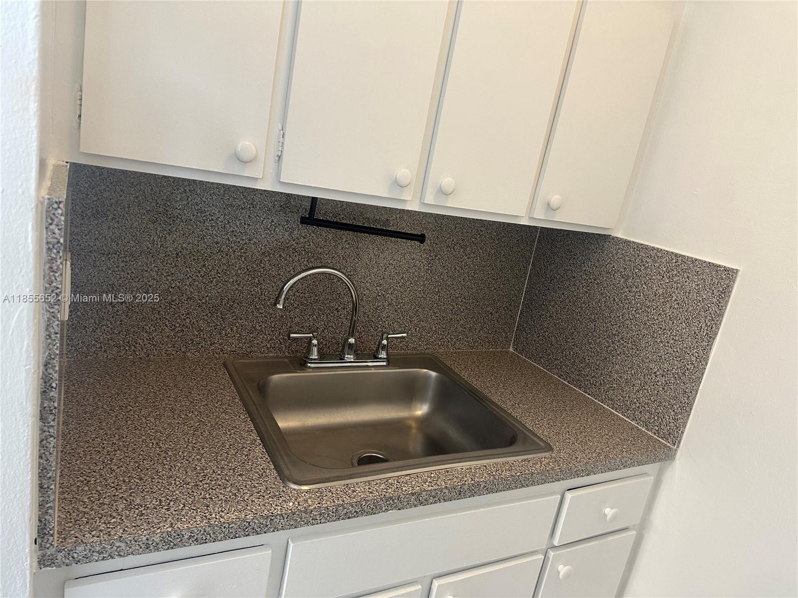 8350 Southwest 65th Avenue, Unit N4 Miami, FL 33143 - Photo 7 of 12 a close view of sink and tap